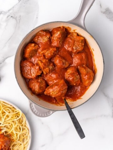 baked turkey meatballs in a pot with sauce.