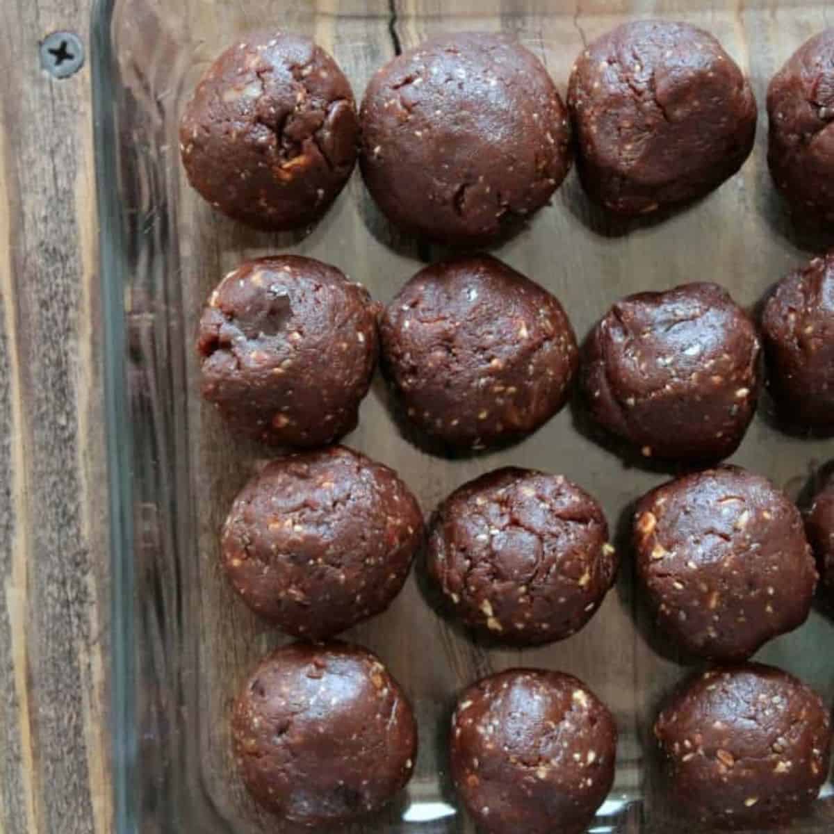 https://www.organizeyourselfskinny.com/wp-content/uploads/2022/12/chocolate-protein-balls-in-a-glass-container.jpg