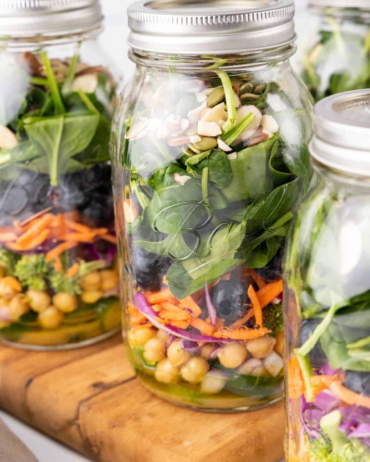 https://www.organizeyourselfskinny.com/wp-content/uploads/2023/03/closeup-view-of-detox-salad-in-a-jar.jpg